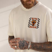 Person wearing a white sweatshirt with a graphic design featuring a tiger and text on a plain background
