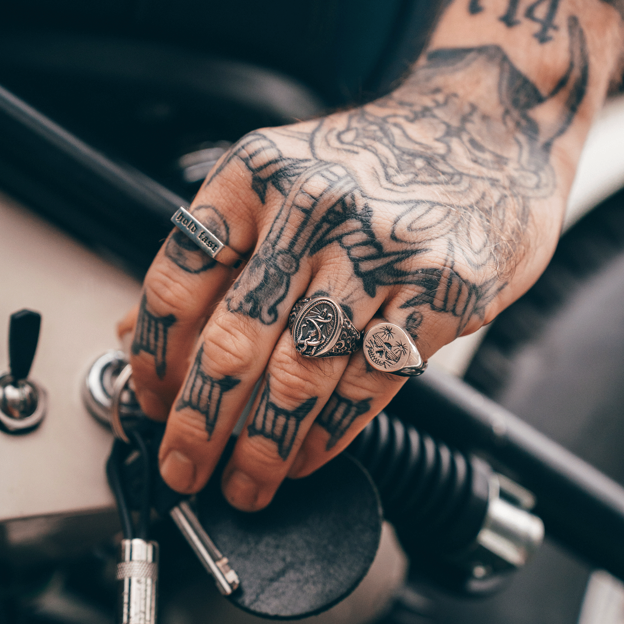 hand with silver rings