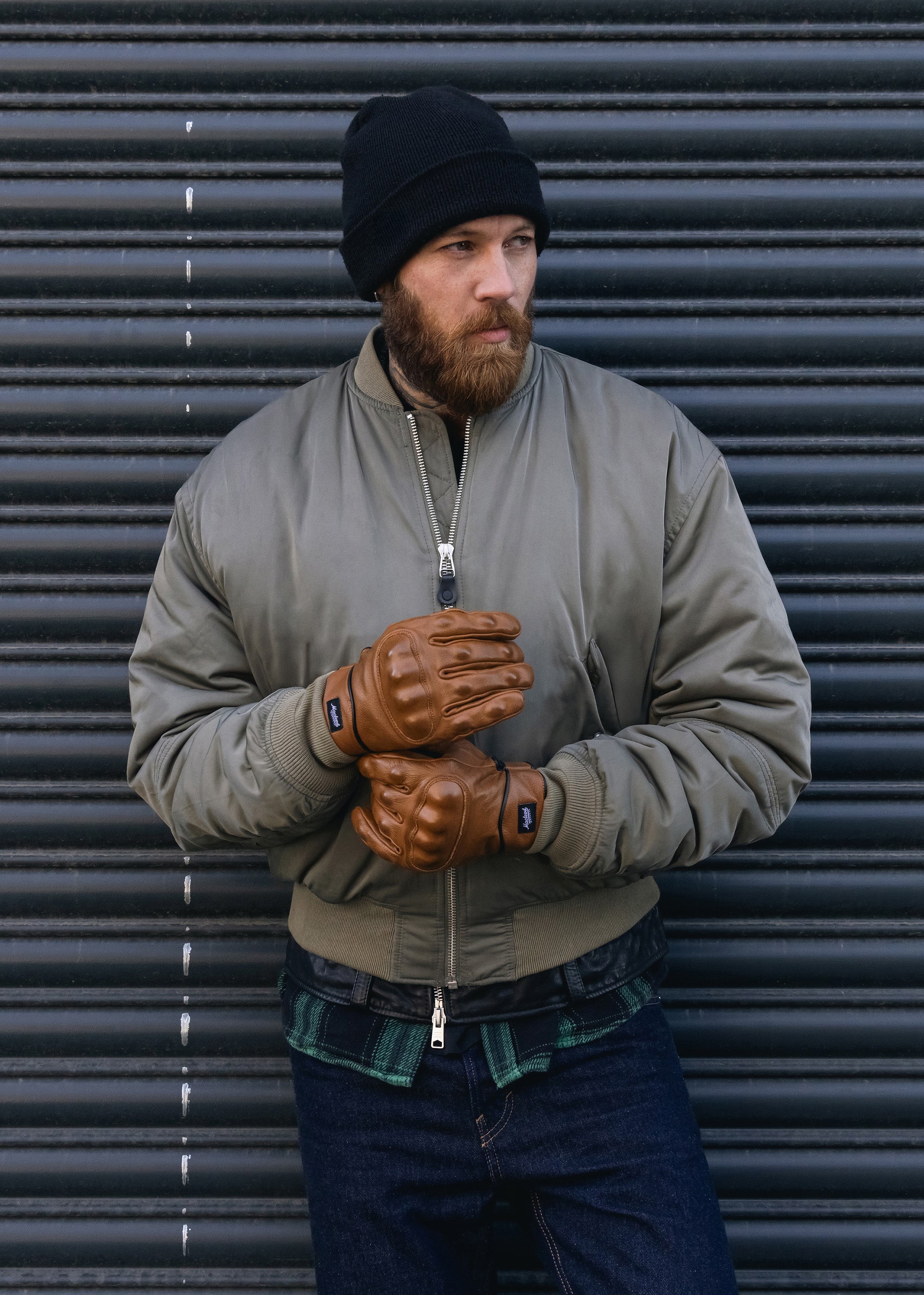 man wearing rebel motorcycle gloves